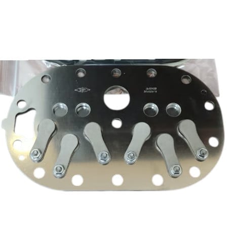 Metal control panel with multiple toggle switches and holes, gradient from black to silver finish